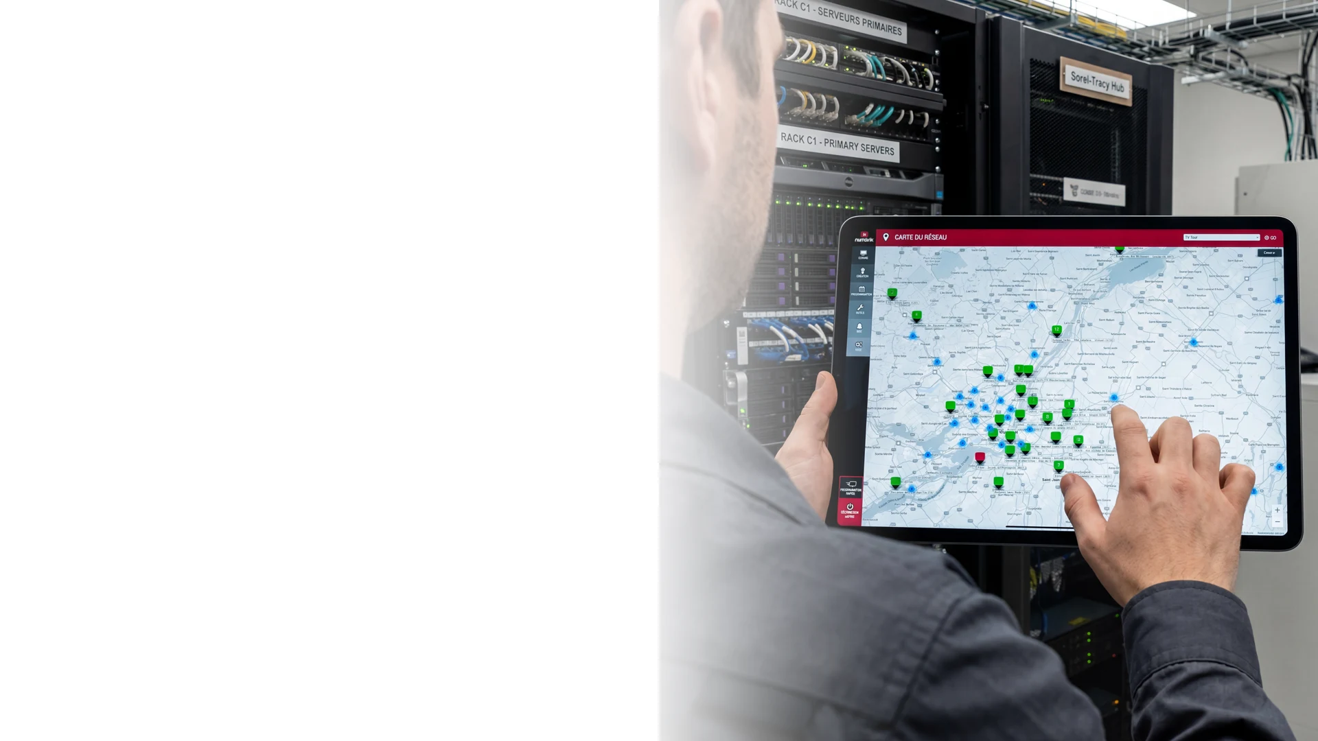 Technician reviewing a Numerik.tv screen network map